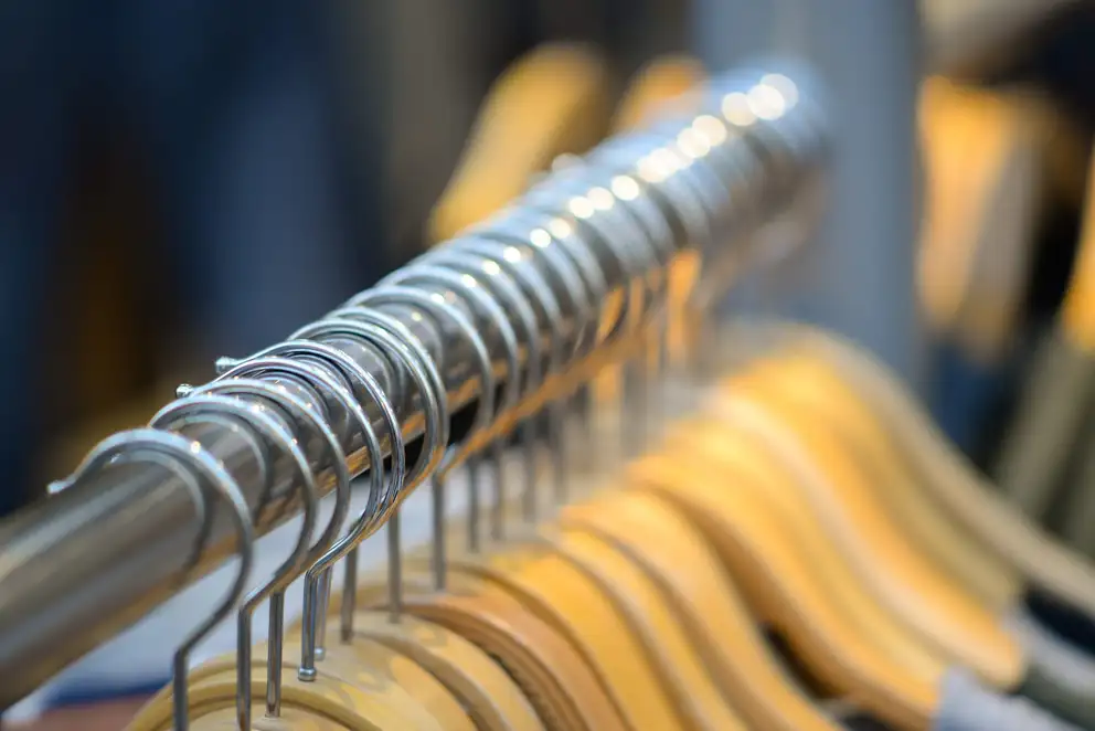 Wooden hangers on a metal rail